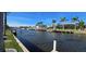 Waterfront views featuring boat docks and canal front houses against a clear blue sky at 931 Bal Harbor Blvd, Punta Gorda, FL 33950