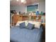 Comfortable bedroom featuring a plush blue bed and eclectic decor on display at 22480 Oceanside Ave, Port Charlotte, FL 33952