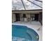 A backyard pool featuring an outdoor dining area and relaxing retreat at 22480 Oceanside Ave, Port Charlotte, FL 33952