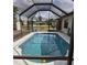A screened-in pool surrounded by patio space, and a relaxing outdoor retreat at 22480 Oceanside Ave, Port Charlotte, FL 33952