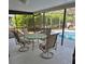 Outdoor seating and partial view of a refreshing swimming pool at 22480 Oceanside Ave, Port Charlotte, FL 33952