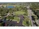 Breathtaking aerial view of the golf course, lush landscaping, and upscale community homes, complete with picturesque parking at 14081 Heritage Landing Blvd # 232, Punta Gorda, FL 33955
