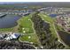 Stunning aerial shot of the golf course community, showcasing the lush fairways, mature trees, and serene lakes at 14081 Heritage Landing Blvd # 232, Punta Gorda, FL 33955