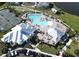 Aerial view of the pool and clubhouse, showcasing the various buildings, umbrellas, and amenities at 14081 Heritage Landing Blvd # 232, Punta Gorda, FL 33955