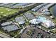 Aerial shot of the community featuring tennis courts, a sparkling pool, well-maintained landscaping, and inviting gathering spots at 14081 Heritage Landing Blvd # 232, Punta Gorda, FL 33955