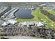 High-angle view displaying a community with a lake and golf course at 14081 Heritage Landing Blvd # 232, Punta Gorda, FL 33955
