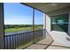 Screened balcony with stunning views of the lake, lush greenery, and golf course, offering a serene outdoor living space at 14081 Heritage Landing Blvd # 232, Punta Gorda, FL 33955