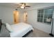 Bright bedroom with large window, ceiling fan, and neutral wall color at 14081 Heritage Landing Blvd # 232, Punta Gorda, FL 33955