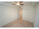 Bright bedroom with ceiling fan, carpeted floors, and a closet with doors at 14081 Heritage Landing Blvd # 232, Punta Gorda, FL 33955