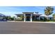 Clubhouse exterior showcasing its modern architectural design with manicured landscaping on a sunny day at 14081 Heritage Landing Blvd # 232, Punta Gorda, FL 33955