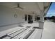 Comfortable covered seating area featuring ceiling fans, benches, and neutral colors at 14081 Heritage Landing Blvd # 232, Punta Gorda, FL 33955