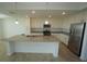 Bright, modern kitchen with granite island, stainless steel appliances, and stylish cabinets at 14081 Heritage Landing Blvd # 232, Punta Gorda, FL 33955