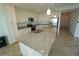 Well-lit kitchen with a large island, stainless steel appliances, and ample counter space at 14081 Heritage Landing Blvd # 232, Punta Gorda, FL 33955