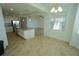 Bright kitchen featuring granite countertops, stainless steel appliances, and an island with sink at 14081 Heritage Landing Blvd # 232, Punta Gorda, FL 33955