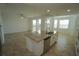 Modern kitchen with stainless appliances, granite countertops, and access to a covered balcony at 14081 Heritage Landing Blvd # 232, Punta Gorda, FL 33955