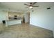 Open concept living room flows into kitchen with stainless appliances and island with sink at 14081 Heritage Landing Blvd # 232, Punta Gorda, FL 33955