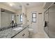 Clean bathroom with granite countertops, a glass shower, and neutral colored walls at 1452 Wassail Ln, Punta Gorda, FL 33983