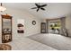 Open living room featuring tile and carpet flooring, vaulted ceilings, and sliding glass doors to the pool area at 1452 Wassail Ln, Punta Gorda, FL 33983