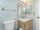 This bathroom is equipped with a single sink vanity and a large mirror, providing a comfortable space at 1515 Forrest Nelson Blvd # R201, Port Charlotte, FL 33952