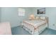 This cozy bedroom is designed with lots of natural light and a comforting atmosphere at 1515 Forrest Nelson Blvd # R201, Port Charlotte, FL 33952