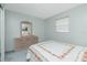 This bedroom features a large dresser and a large window, providing lots of storage and natural light at 1515 Forrest Nelson Blvd # R201, Port Charlotte, FL 33952