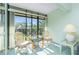 Relaxing lanai space with comfortable chairs and a view of the community pool at 1515 Forrest Nelson Blvd # R201, Port Charlotte, FL 33952