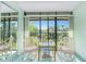 Cozy lanai with seating, offering a view of the lush landscaping and community at 1515 Forrest Nelson Blvd # R201, Port Charlotte, FL 33952