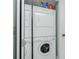 This laundry area includes a stacked washer and dryer, maximizing space and convenience at 1515 Forrest Nelson Blvd # R201, Port Charlotte, FL 33952