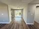 Dining area featuring modern flooring, neutral paint, and sliding glass doors to the backyard at 1625 Meadow Lark Ln, Englewood, FL 34224