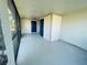 Screened porch with entrance to building at 1625 Meadow Lark Ln, Englewood, FL 34224