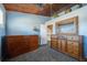 Bedroom with wooden ceiling, built-in cabinets, and a rustic dresser with a large mirror at 18419 Meyer Ave, Port Charlotte, FL 33948