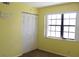 Bedroom with a closet, neutral walls and a big window at 19505 Quesada Ave # Mm202, Port Charlotte, FL 33948