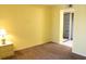 Bedroom with carpeted floor, closet, and yellow walls at 19505 Quesada Ave # Mm202, Port Charlotte, FL 33948