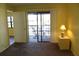 Bedroom featuring an open sliding glass door to a patio with table and chairs at 19505 Quesada Ave # Mm202, Port Charlotte, FL 33948