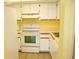 Bright kitchen featuring white appliances and cabinetry at 19505 Quesada Ave # Mm202, Port Charlotte, FL 33948