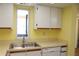 Bright kitchen featuring neutral countertops and stainless steel sink at 19505 Quesada Ave # Mm202, Port Charlotte, FL 33948