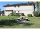 Well-maintained community picnic area with seating and a grill at 19505 Quesada Ave # Mm202, Port Charlotte, FL 33948