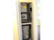 Utility closet containing air handler and hot water tank at 19505 Quesada Ave # Mm202, Port Charlotte, FL 33948