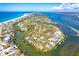 Stunning aerial view of waterfront property with sandy beaches and turquoise water views at 20 Palm Dr, Placida, FL 33946