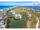 Expansive aerial view of waterfront property with sandy beaches and gorgeous turquoise water views at 20 Palm Dr, Placida, FL 33946