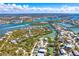 Aerial view of homes in coastal neighborhood with surrounding waterway at 20 Palm Dr, Placida, FL 33946