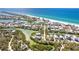 Beautiful aerial view of waterfront property with sandy beaches, lush trees and turquoise water views at 20 Palm Dr, Placida, FL 33946