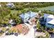 Aerial view of waterfront home with two-story construction and standing seam metal roof at 20 Palm Dr, Placida, FL 33946