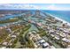 High aerial view of waterfront community surrounded by canals and a sandy beach nearby at 20 Palm Dr, Placida, FL 33946