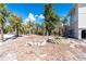 Spacious backyard with lush tropical landscaping and custom stone planters, perfect for outdoor entertaining at 20 Palm Dr, Placida, FL 33946