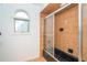 Full bath featuring a tub with sliding glass door, a small window, and neutral wall color at 20 Palm Dr, Placida, FL 33946