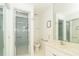 Bright white bathroom with glass shower and marble countertops at 20 Palm Dr, Placida, FL 33946