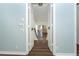 Upstairs view from hallway through double doors showing light blue wall with white trim at 20 Palm Dr, Placida, FL 33946