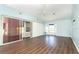 Bright living room with wood floors, sliding glass doors, and a ceiling fan at 20 Palm Dr, Placida, FL 33946