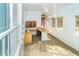Unfinished room features tile floors, large windows, ceiling fan, and a built-in kitchenette area at 20 Palm Dr, Placida, FL 33946